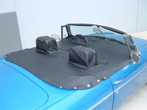 Our <strong>Karmann Ghia tonneau covers</strong> come with a bag of snaps and a kit for popping them in place. . Tonneau covers for convertibles